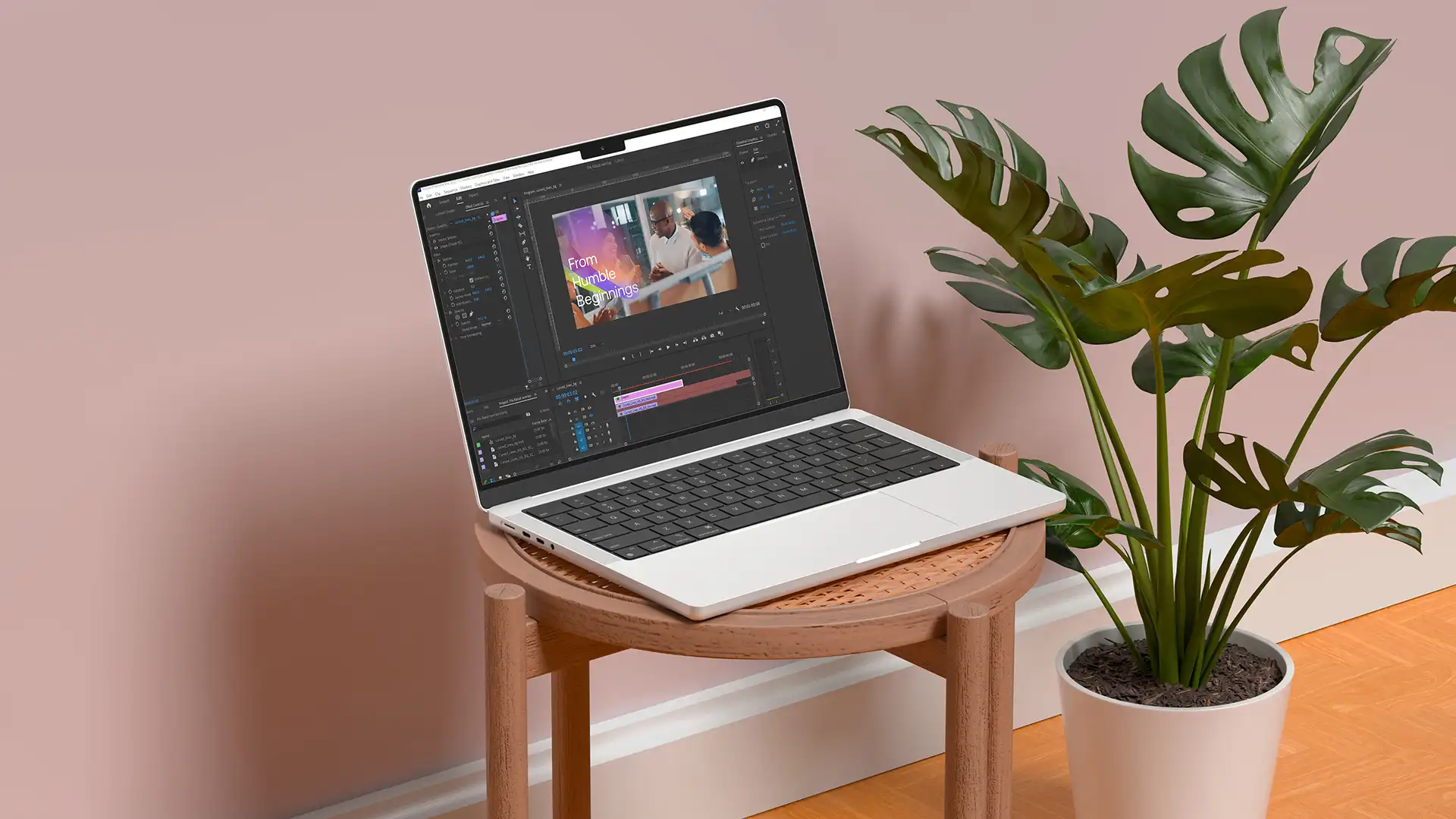Laptop using video editor on top of a table